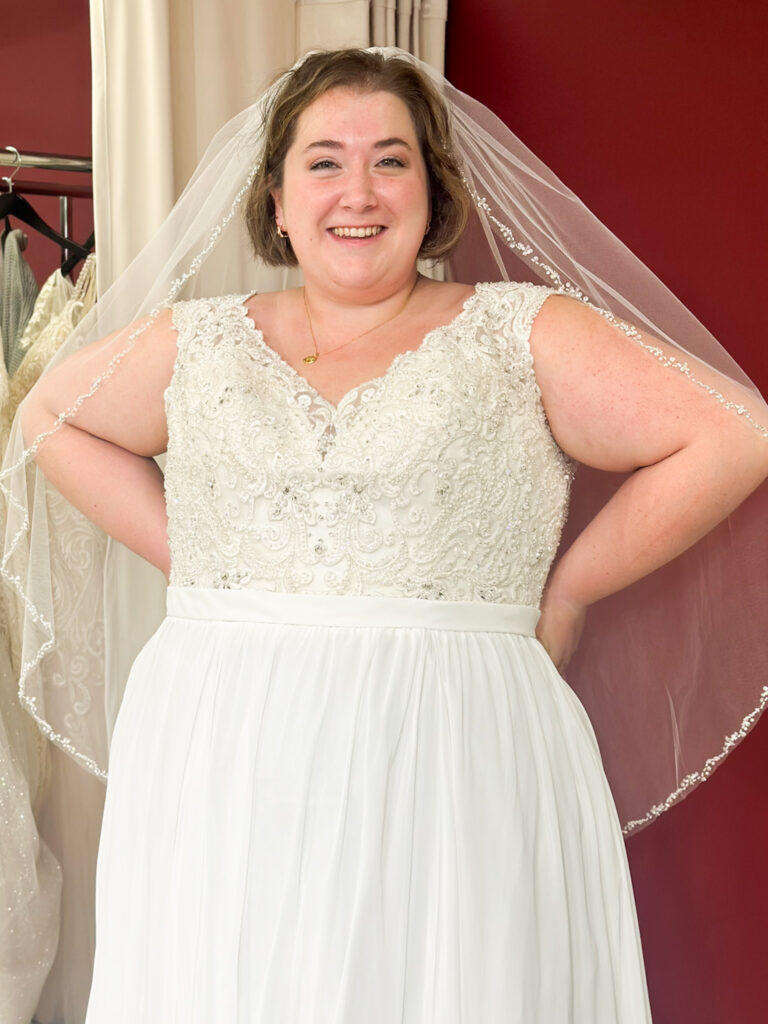 bride wearing plus size off the rack wedding dress in affordable orange county bridal shop