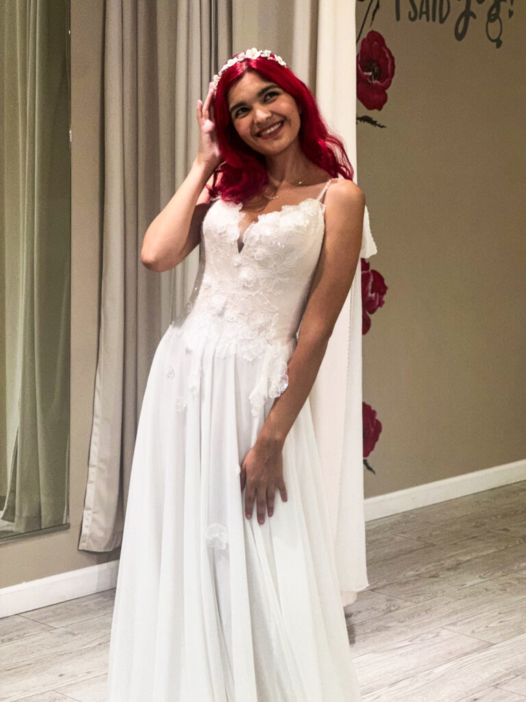 petite bride wearing off the rack wedding dress in affordable orange county bridal shop