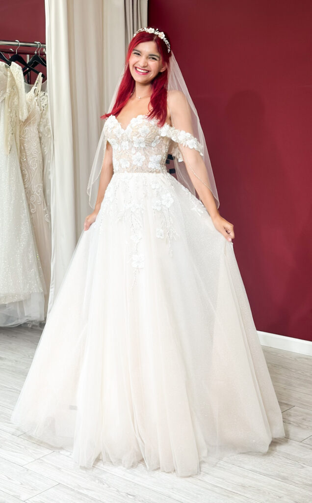 woman wearing off the rack petite size wedding dress in los angeles california bridal shop
