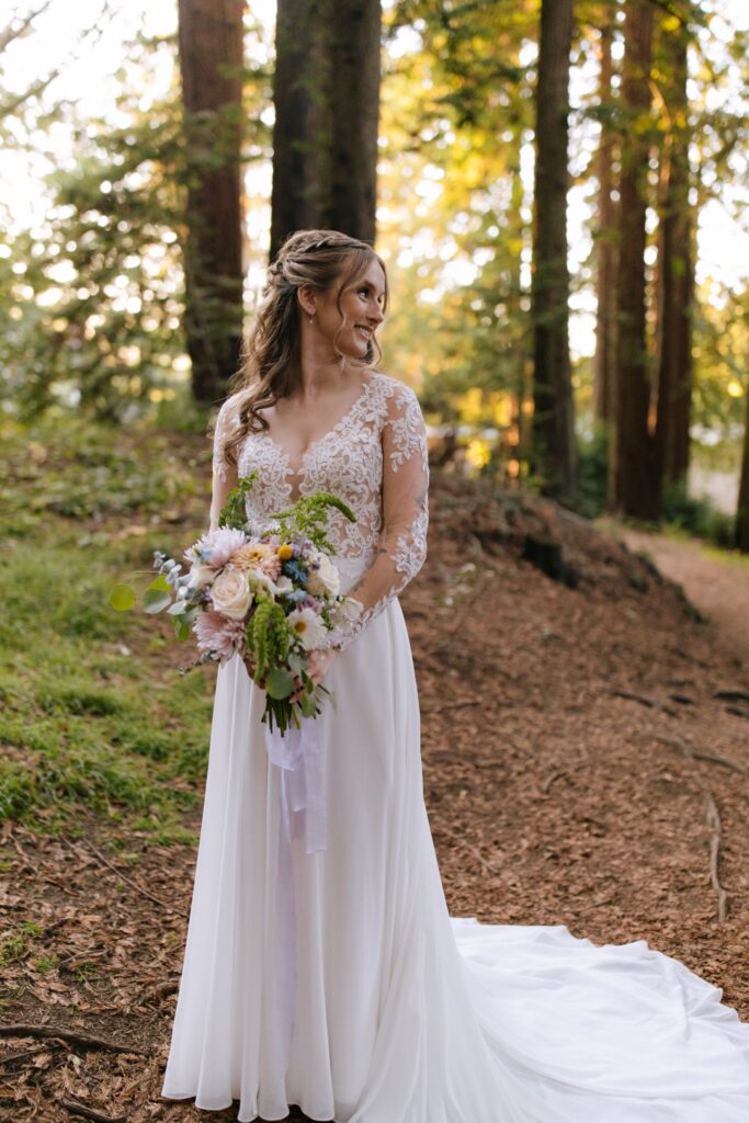 best long sleeve off the rack wedding dress in forest setting
