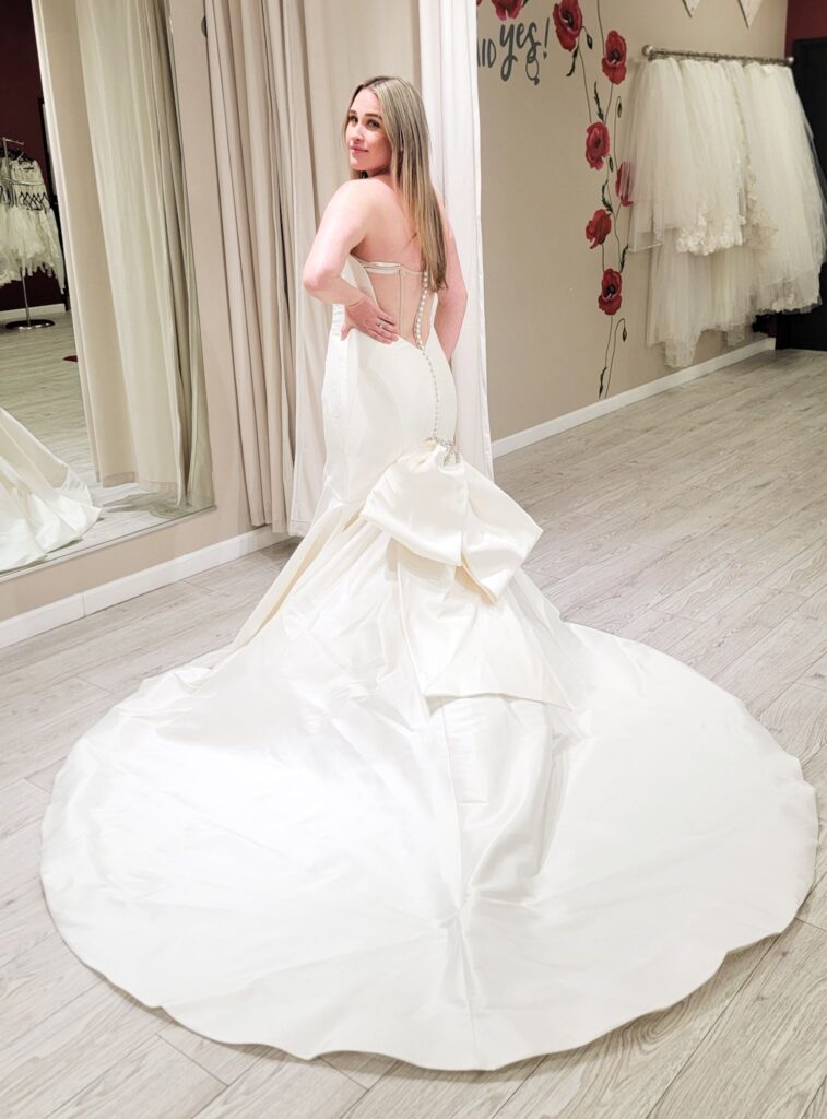 mid size bride wearing satin mermaid with huge bow