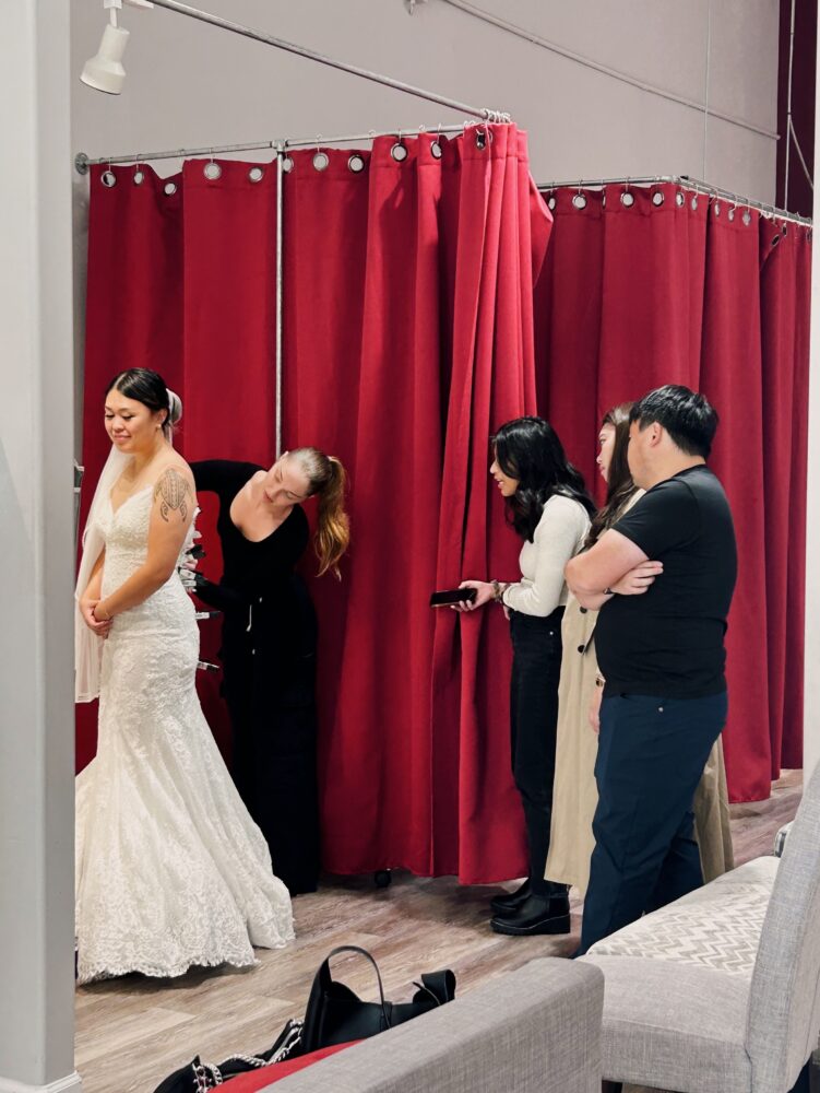bride shopping with family in hayward california bridal store