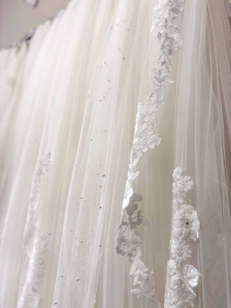wedding dress veils hanging in hayward bridal store